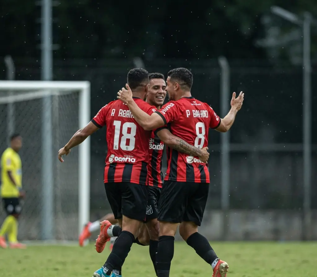 Bahia vence Santos por 2 a 0 e ganha fôlego na briga pelo brasileiro sub-20 Jogadores do Bahia comemorando de costas após gol, estádio ao fundo